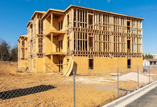 temporary fencing enclosing a construction site for privacy and protection in Bethel